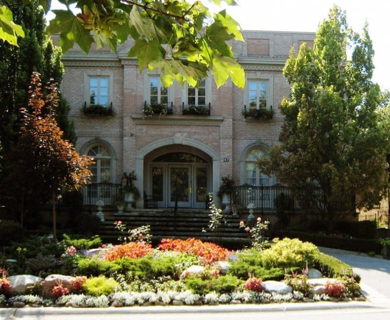 This seven-bedroom, eight-bath York Downs home boasts luxurious features that include an indoor pool, a five-car underground garage and an elevator that services all three levels.